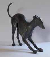 Whippet dog playing, small bronze.