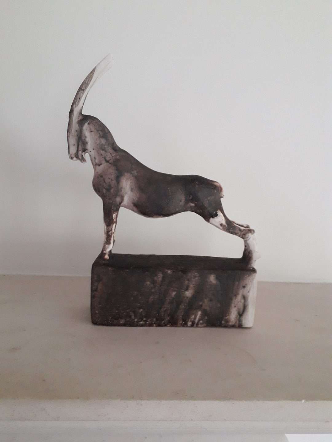 ceramic ibex goat sculpture, small goat sculpture, raku fired goat